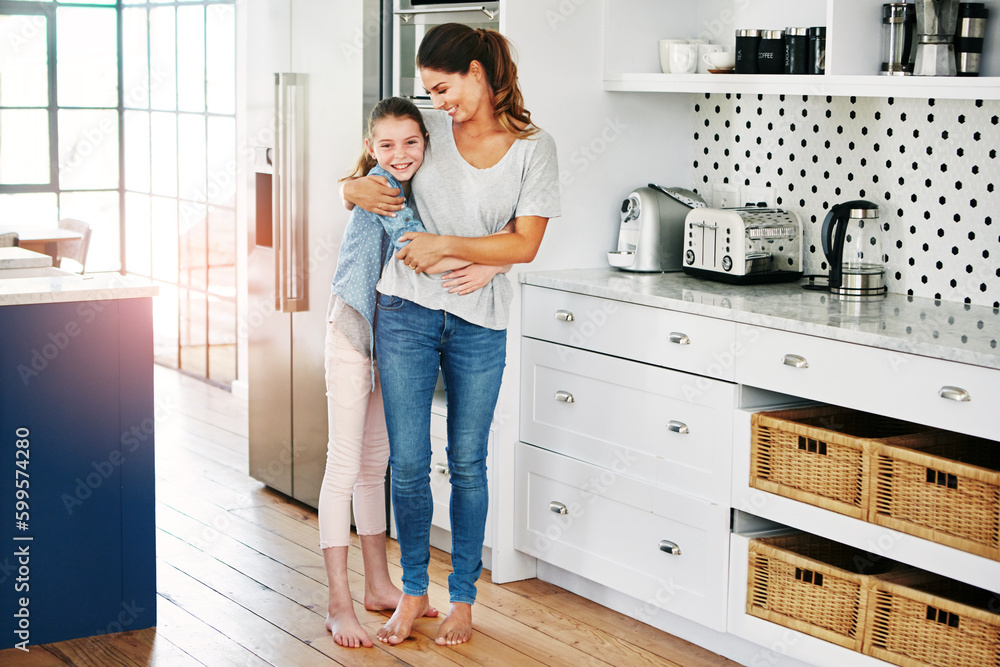 Savoring the moments they get to spend together. Portrait of a happy mother and daughter in a loving embrace at home. Savoring the moments they get to spend together. Portrait of a happy mother and daughter in a loving embrace at home.