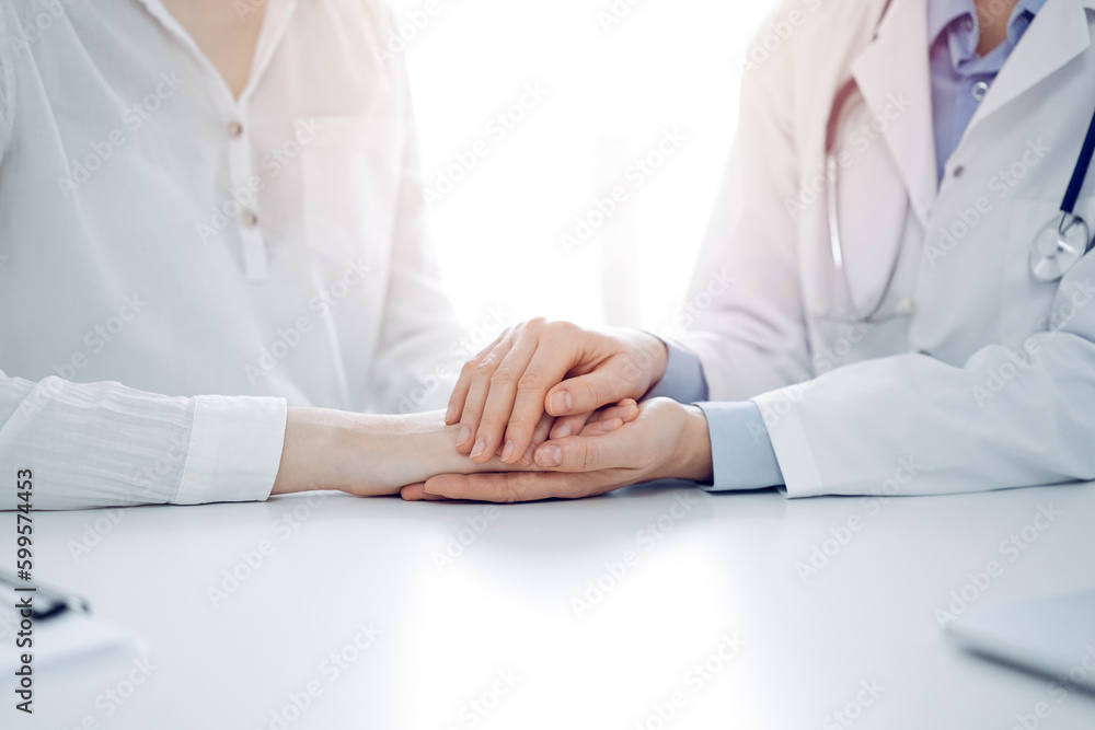 Stethoscope lying on the tablet computer in front of a doctor and patient sitting opposite each other at the background . Medicine, healthcare concept Stethoscope lying on the tablet computer in front of a doctor and patient sitting opposite each other at the background . Medicine, healthcare concept