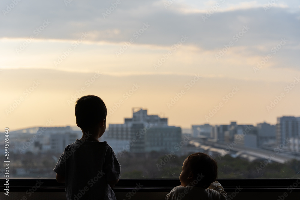 a brother and a sister looking over the landscape of Kobe, Hyogo Japan a brother and a sister looking over the landscape of Kobe, Hyogo Japan