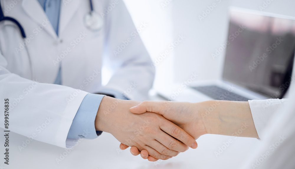 Stethoscope lying on the tablet computer in front of a doctor and patient sitting opposite each other at the background . Medicine, healthcare concept Stethoscope lying on the tablet computer in front of a doctor and patient sitting opposite each other at the background . Medicine, healthcare concept