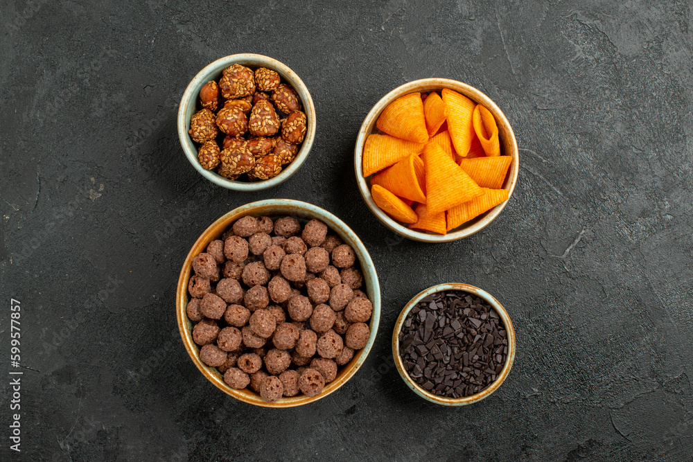 top view chocolate flakes with chips and nuts on dark background corn colors nut top view chocolate flakes with chips and nuts on dark background corn colors nut