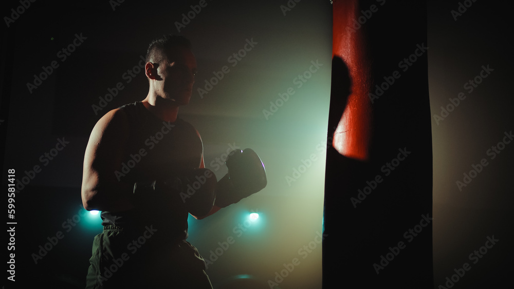 Boxer trains at the punch bag