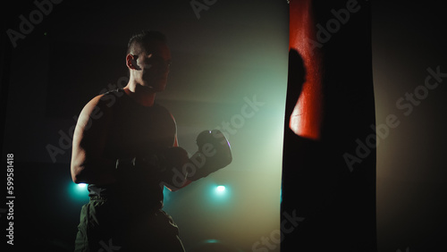 Boxer trains at the punch bag