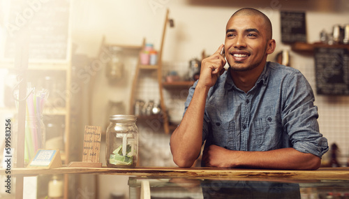 Smile, phone call and man with startup success, connection and communication for planning. Male person, happy employee and business owner with happiness, conversation and discussion in store and shop