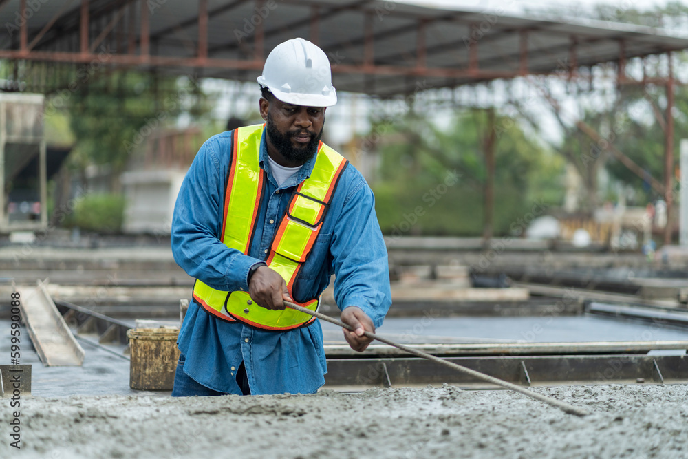 Male worker in a precast wall factory (Precast) is forming a wall with cement. and smooth the plaster in the prepared mold Male worker in a precast wall factory (Precast) is forming a wall with cement. and smooth the plaster in the prepared mold