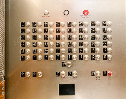 high-speed elevator panel buttons of a fifty one-story high-rise building