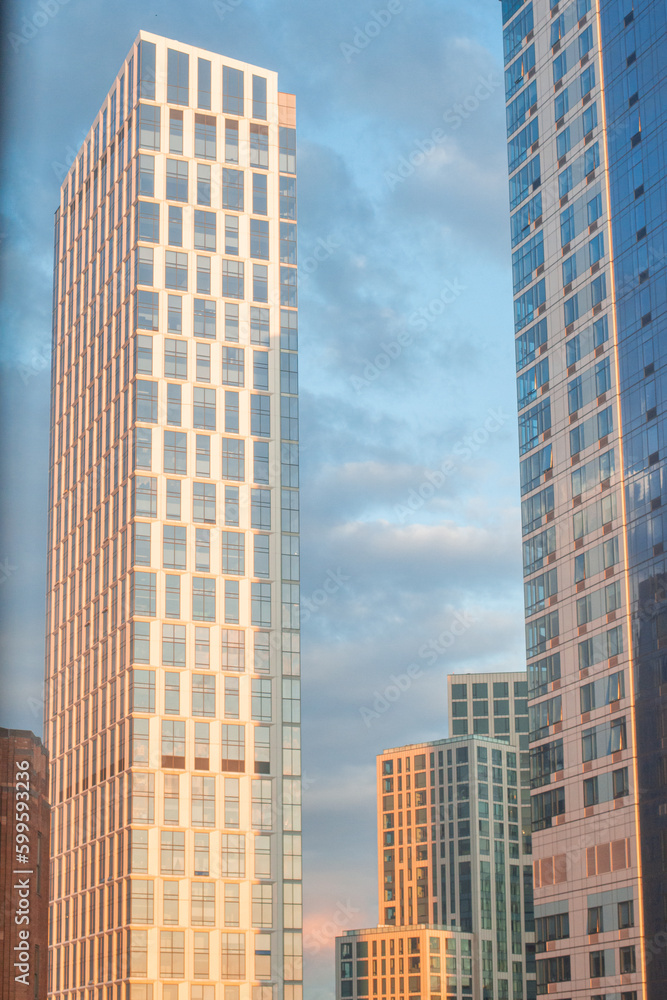 sunset is reflected by the windows of skyscrapers in downtown brooklyn
