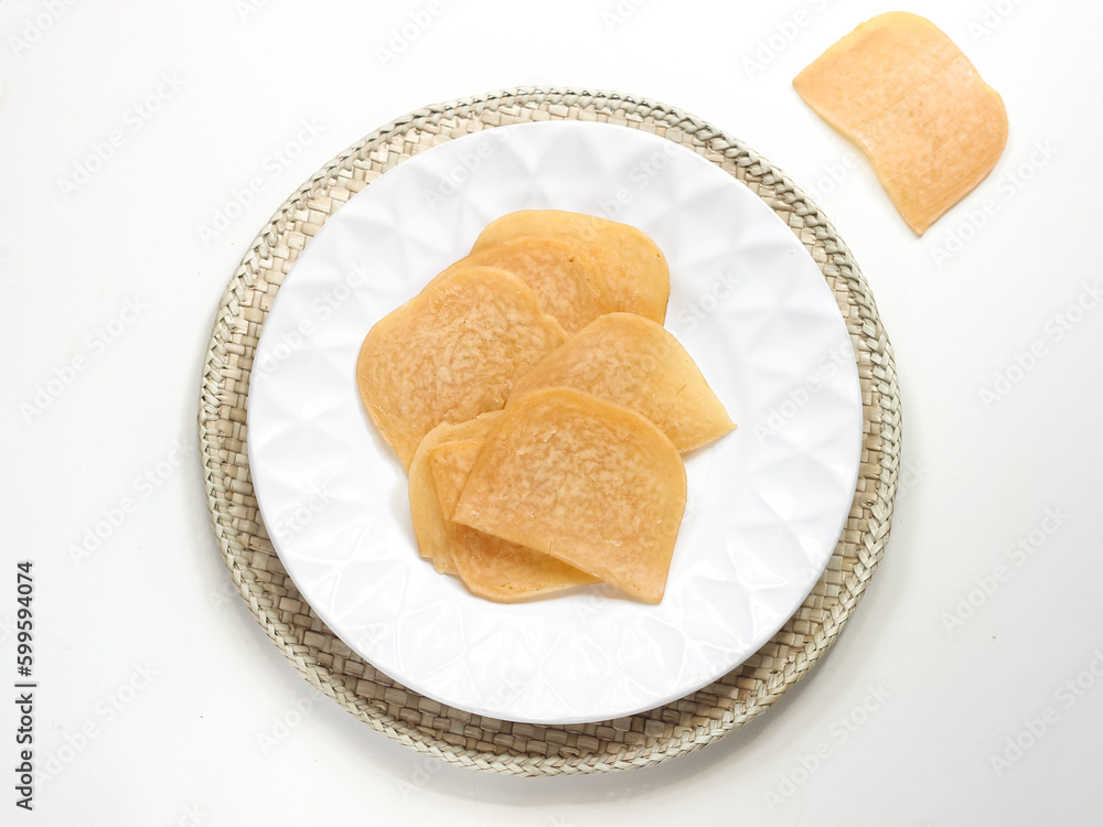 Kerupuk Udang Mentah or Raw Shrimp Crackers in white plate Kerupuk Udang Mentah or Raw Shrimp Crackers in white plate
