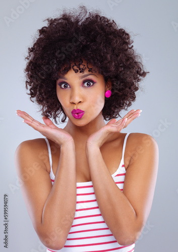 Face  beauty and portrait of black woman in studio on gray background for makeup  skincare or cosmetics. Young female  model pouting and pink lipstick or eyeshadow and natural hair confidence