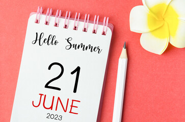 The Hello Summer on 21st June 2023 calendar and pen with flower on red background.