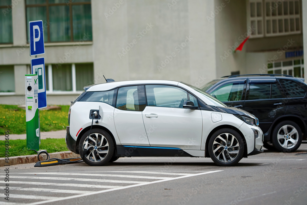 Minsk, Belarus. Apr 2023. BMW I3 car charging at public power station