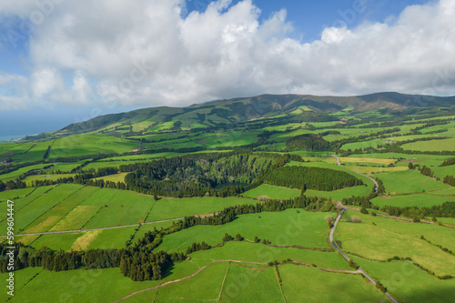 Aerial view of the landscapes on Sao Miguel Island, green farmland and volcanic mountains and lakes, Azores, Portugal © Sen