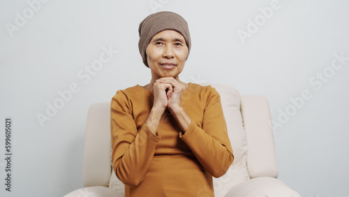 Mature woman suffering from cancer, asian people, 70s years old with headscarf, elderly cancer awareness concept.