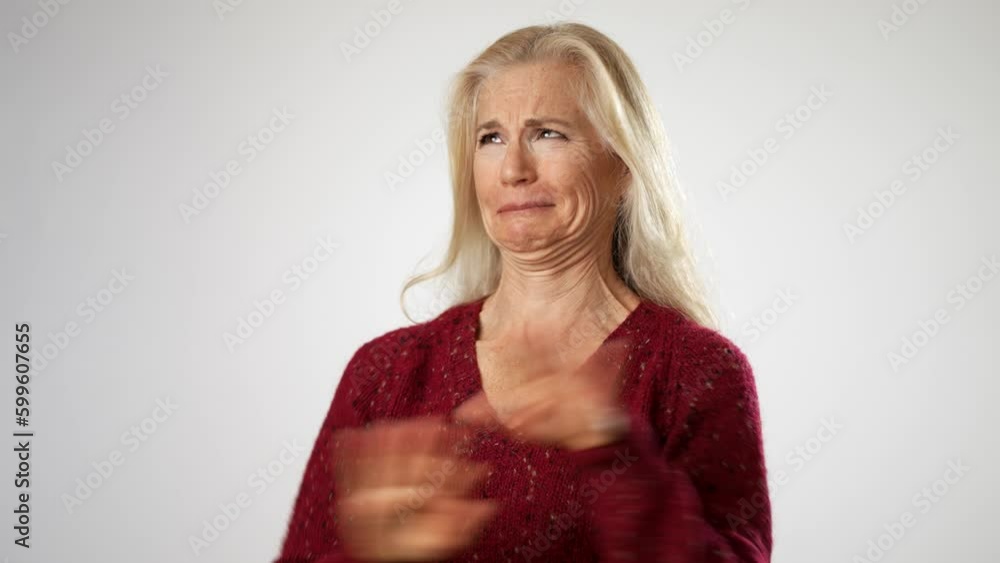Elderly mature blonde woman lady 50s years old wears red sweater look camera pointing fingers herself ask say who me no thanks i do not need it isolated on solid white background studio portrait Elderly mature blonde woman lady 50s years old wears red sweater look camera pointing fingers herself ask say who me no thanks i do not need it isolated on solid white background studio portrait