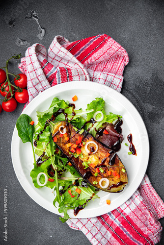 eggplant salad green leaves fried vegetable meal snack on the table copy space food background rustic top view photo