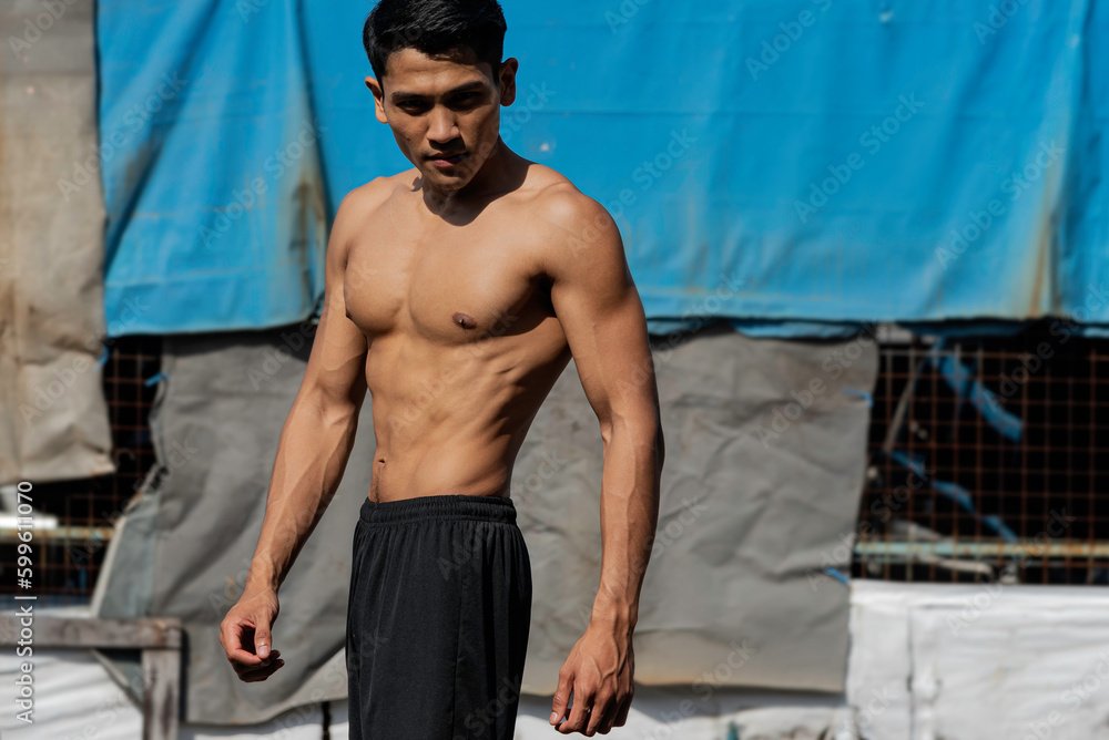 Fitness man exercise training warm up body and posing in gym, Healthy lifestyle.