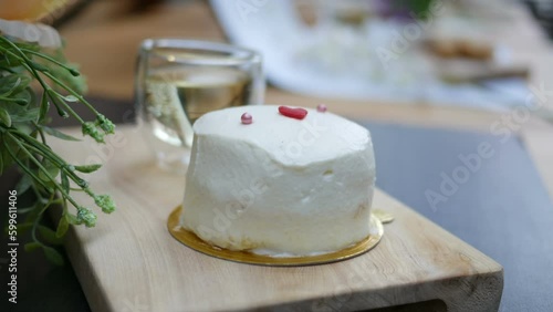 young coconut cake with fresh cream  on white plate