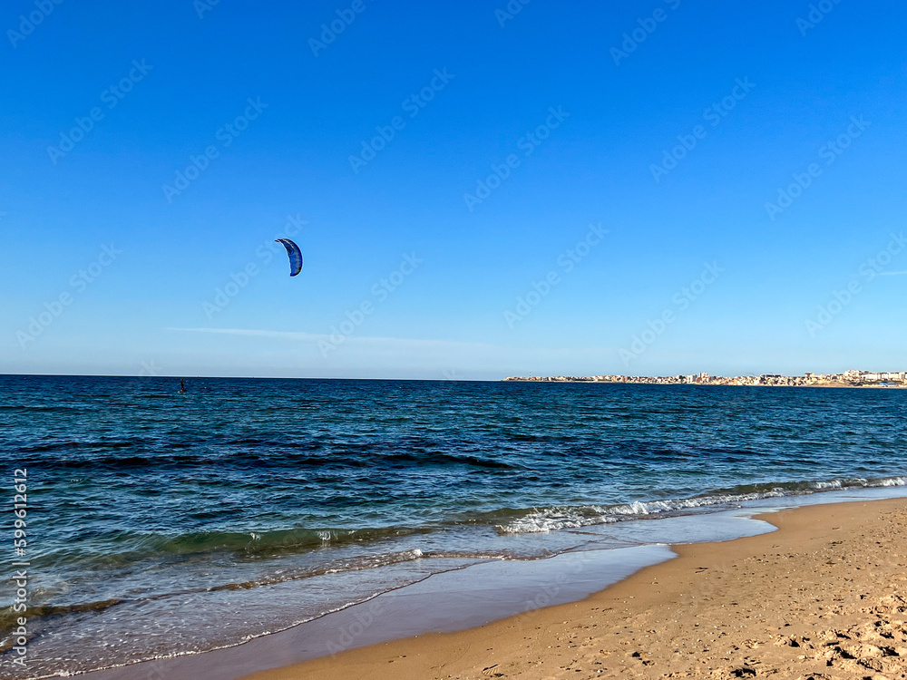 Kite surfer rides on the water in Staoueli, Algeria