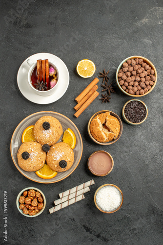 top view yummy cookies with cup of tea on the dark background cake pie sugar dessert biscuit tea