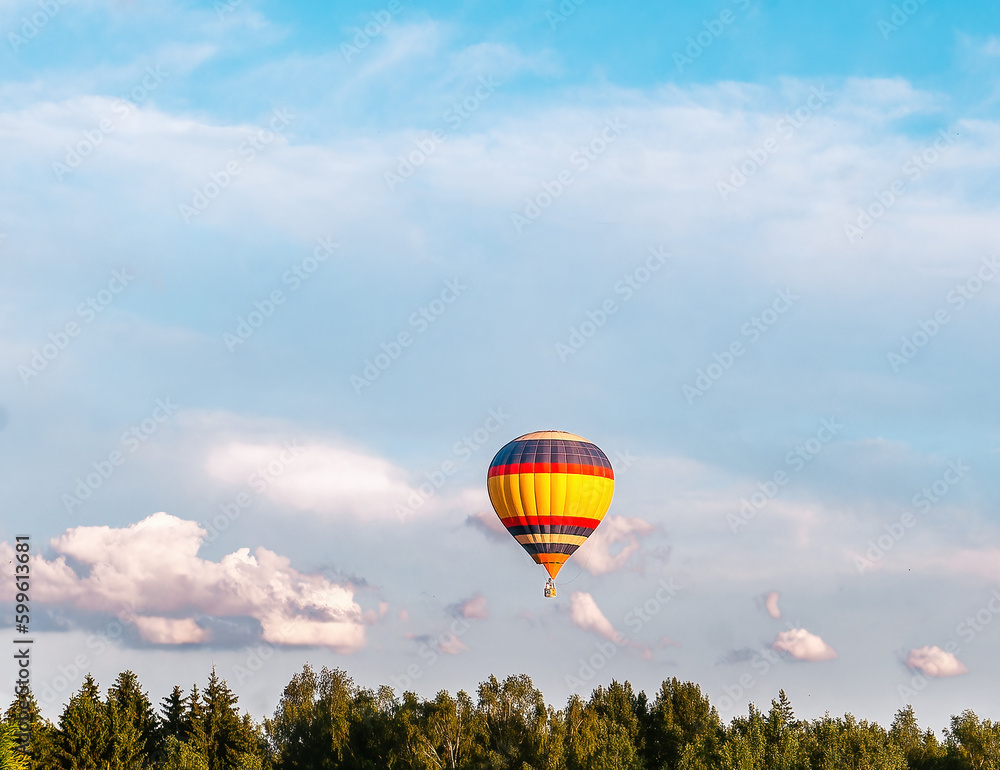 Bright balloon flying in the blue sky