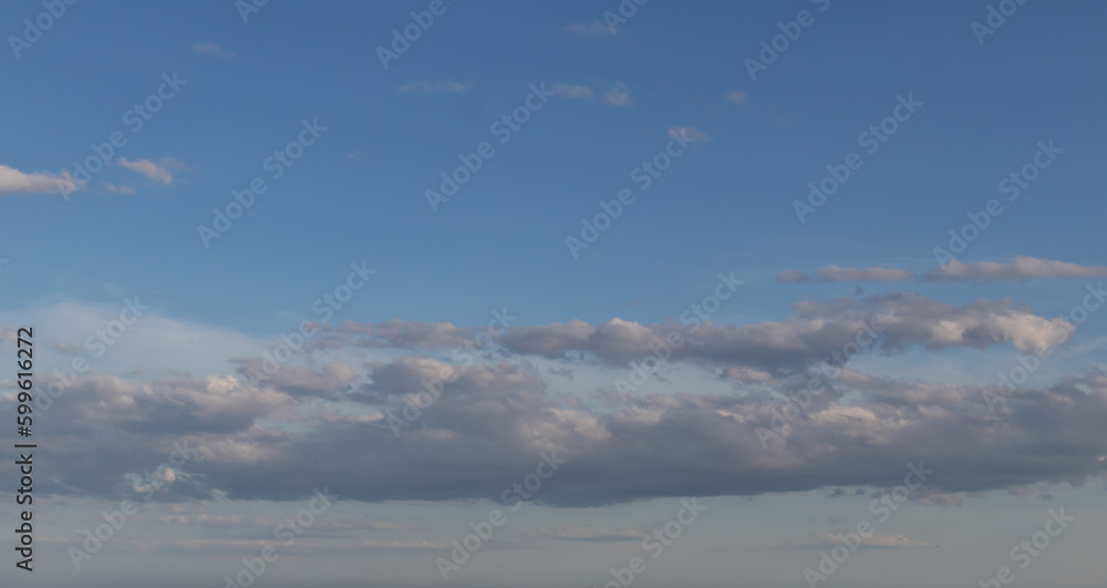 Sky replacement blue sky gray and white clouds hovering in horizon