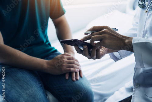 Male patient having consultation with doctor or psychiatrist who working on diagnostic examination on men s health disease or mental illness in medical clinic or hospital mental health service center