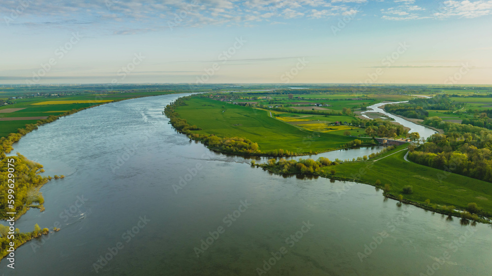 Floodgate in Biała Góra. Where the Nogat River flows from the Vistula. View from the drone, morning, spring. Poland.