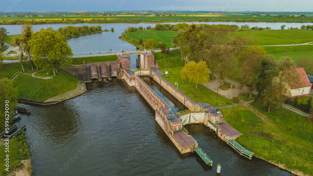 Obraz premium Floodgate in Biała Góra. Where the Nogat River flows from the Vistula. View from the drone, morning, spring. Poland.