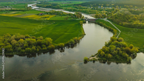 Floodgate in Biała Góra. Where the Nogat River flows from the Vistula. View from the drone, morning, spring. Poland.