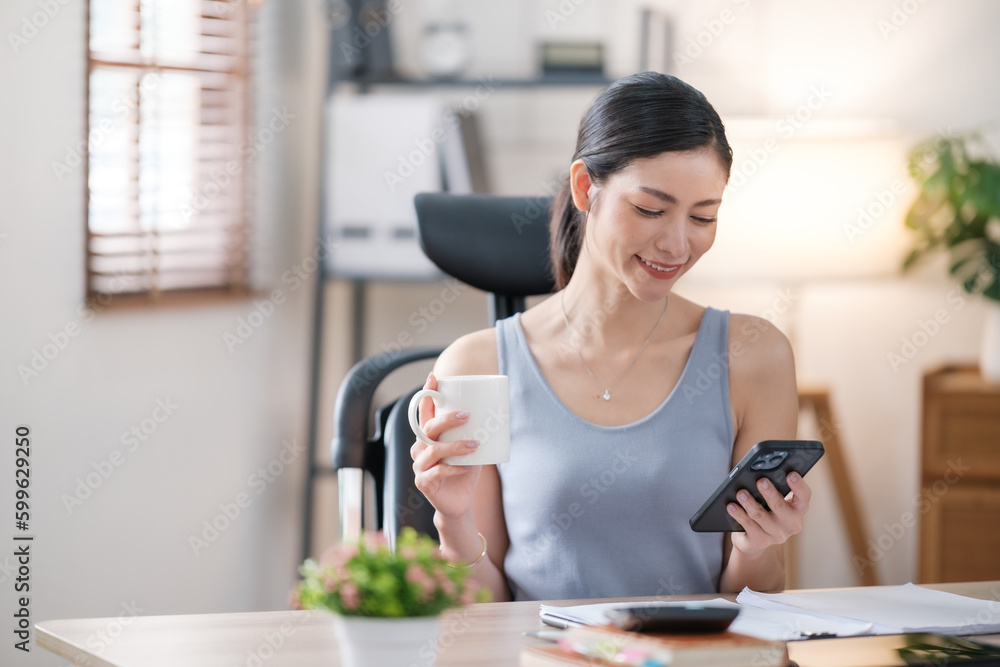 Beautiful Asian young woman wear casual working with social media.Freelance woman working online sale marketing. Shopping online at home. Beautiful Asian young woman wear casual working with social media.Freelance woman working online sale marketing. Shopping online at home.