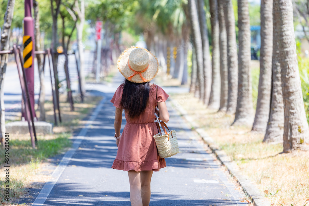 Woman walk into the park