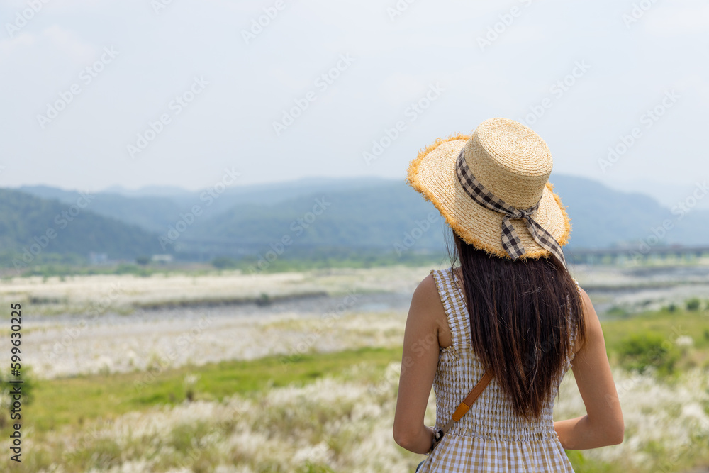 Travel woman look at the Huoyan Mountain in Taichung of Taiwan Travel woman look at the Huoyan Mountain in Taichung of Taiwan