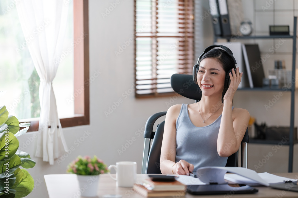 Beautiful Asian young woman wear casual working with social media.Freelance woman working online sale marketing. Shopping online at home. Beautiful Asian young woman wear casual working with social media.Freelance woman working online sale marketing. Shopping online at home.