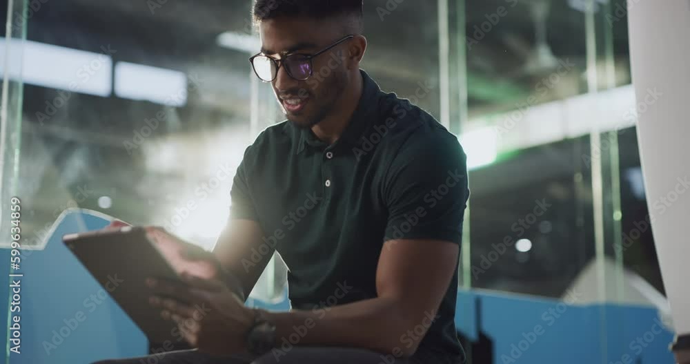 Tablet, happy and businessman working online or on the internet on a project in a tech startup company. Worker, technology and man employee typing a proposal or strategy at the workplace or office Tablet, happy and businessman working online or on the internet on a project in a tech startup company. Worker, technology and man employee typing a proposal or strategy at the workplace or office