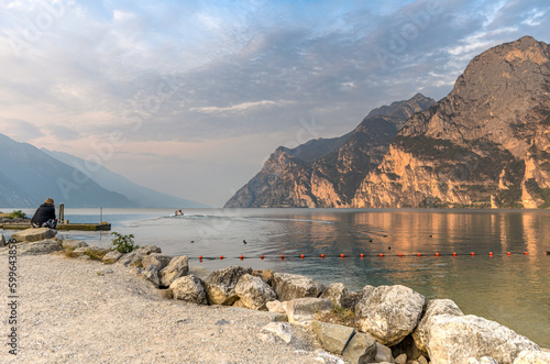City of Riva del Garda by Garda lake in Italy. View from the lake shore