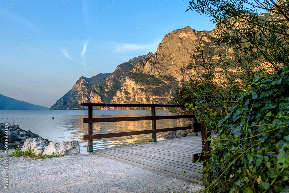 Obraz premium City of Riva del Garda by Garda lake in Italy. View from the lake shore