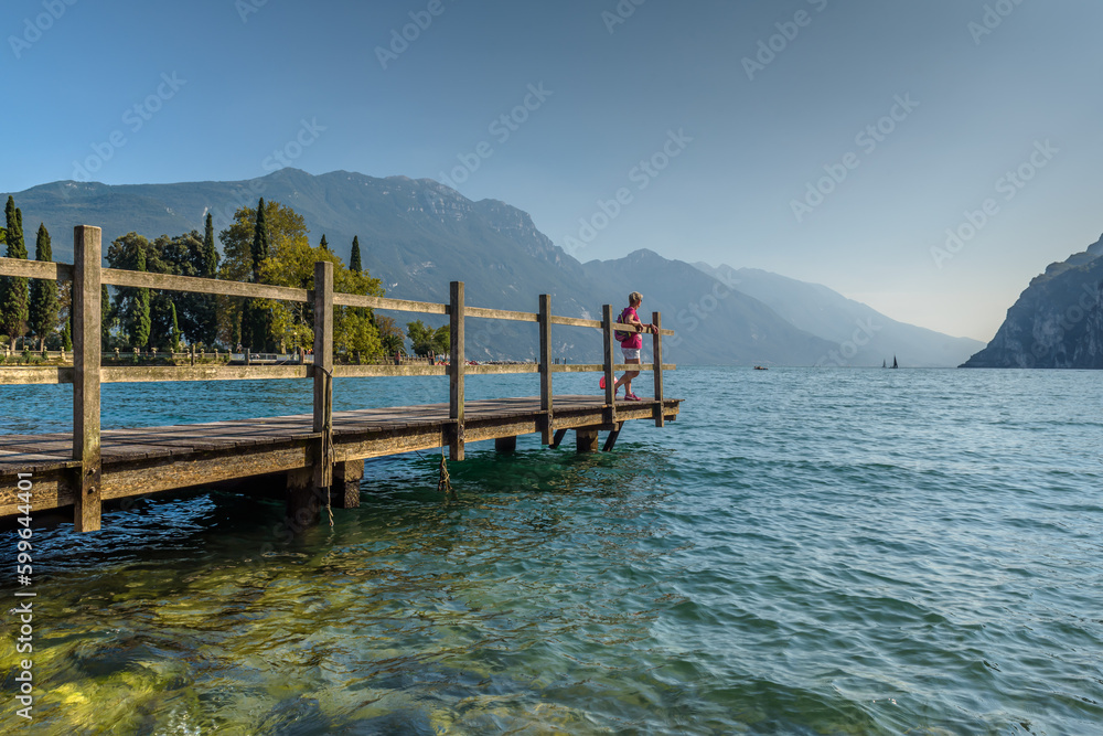 City of Riva del Garda by Garda lake in Italy. View from the lake shore
