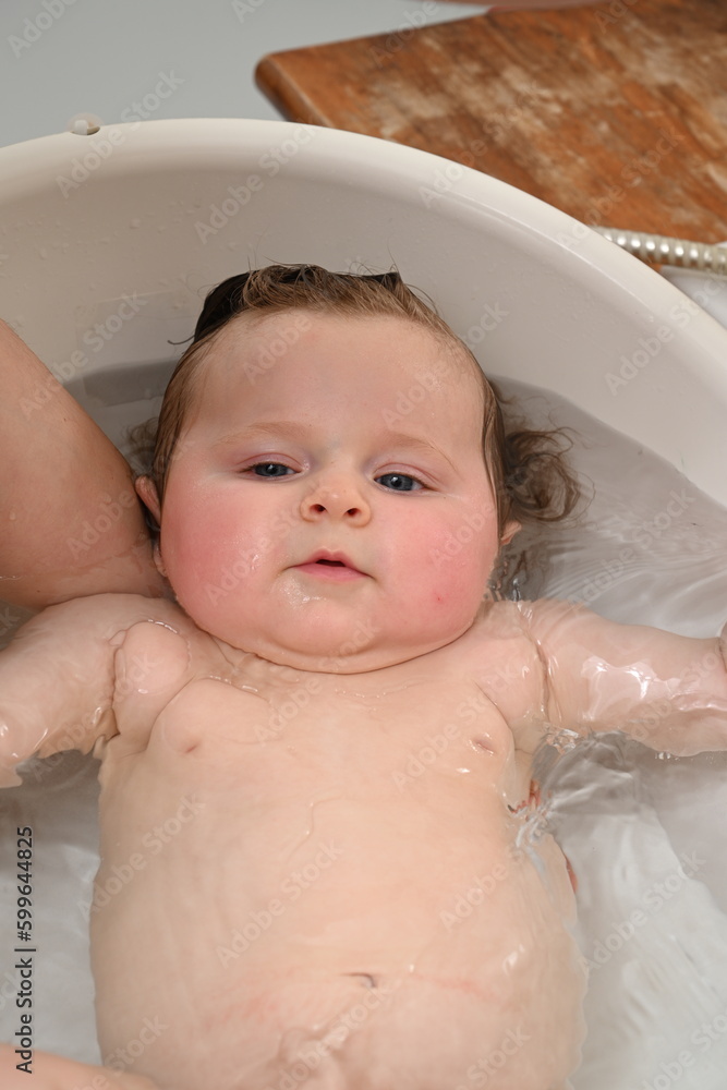 calm newborn taking a bath calm newborn taking a bath