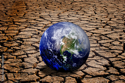 planet earth on dry ground, clomate change and global warming