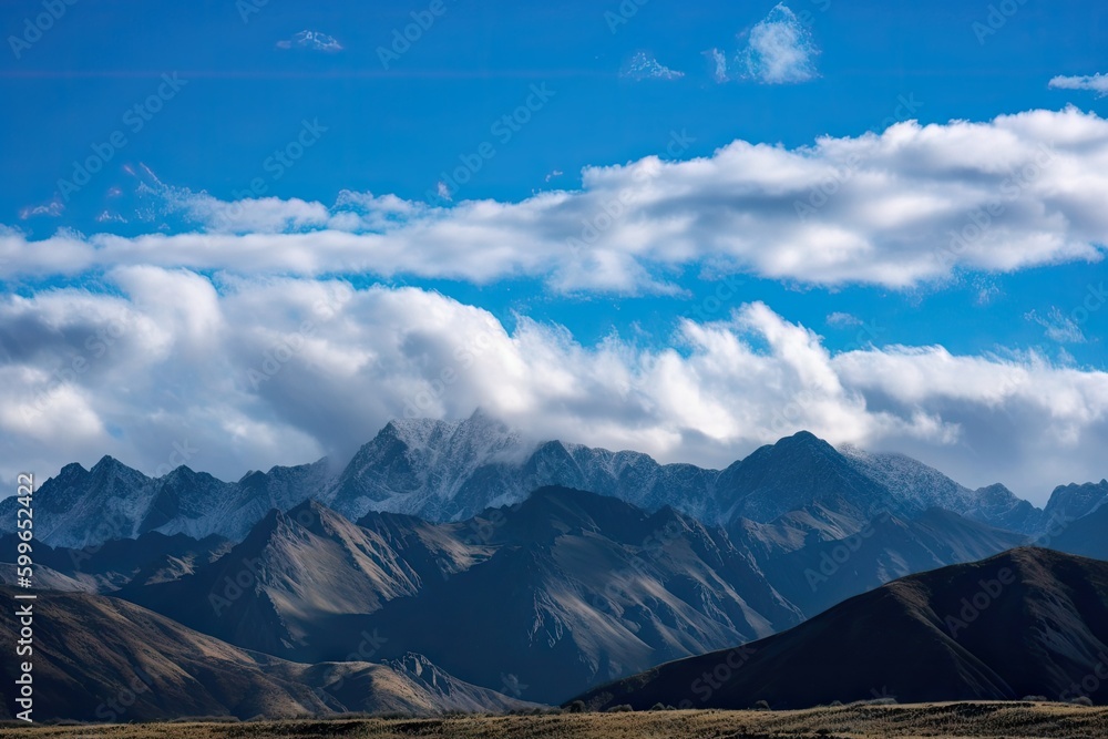 Fototapeta premium view of majestic mountain range, with clear blue skies and fluffy clouds overhead, created with generative ai