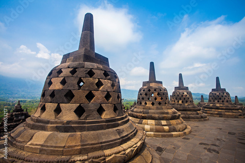 The stupas are lined up in the Borobudur Temple complex. Borobudur Temple is the largest Buddhist temple in the world, located in Magelang, Yogyakarta, Indonesia.