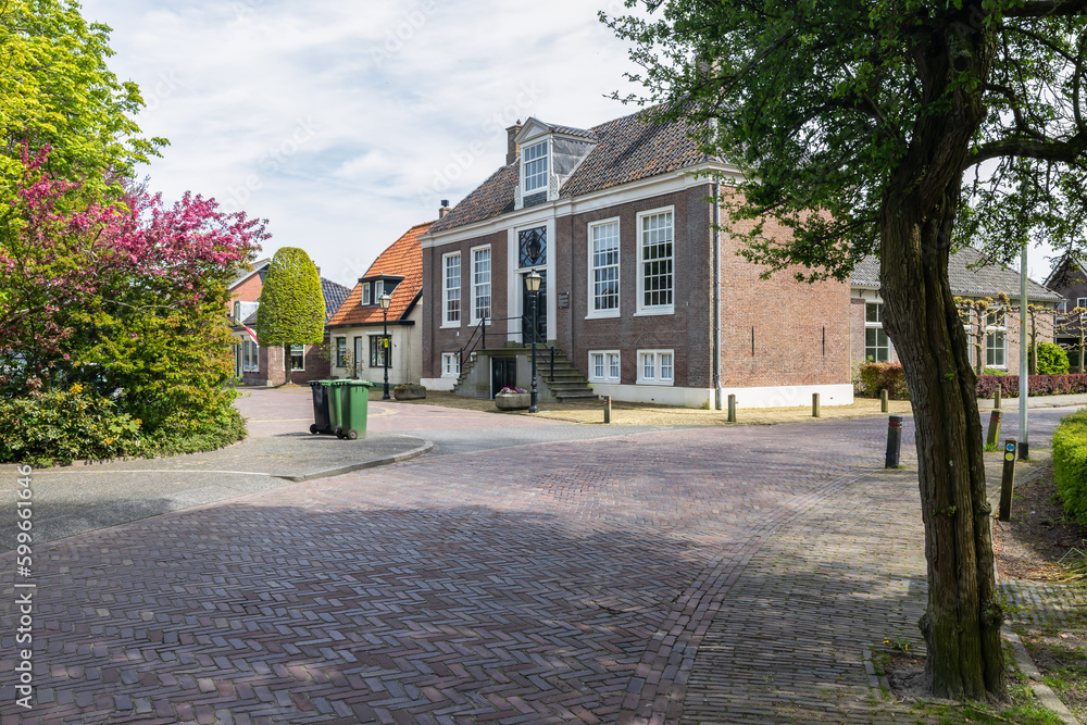 Village view overlooking the former 18th century town hall in the village of Hoogwoud in West Friesland. Village view overlooking the former 18th century town hall in the village of Hoogwoud in West Friesland.