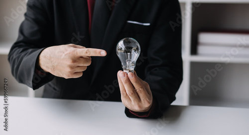 hand holding light bulb. idea concept with innovation and inspiration