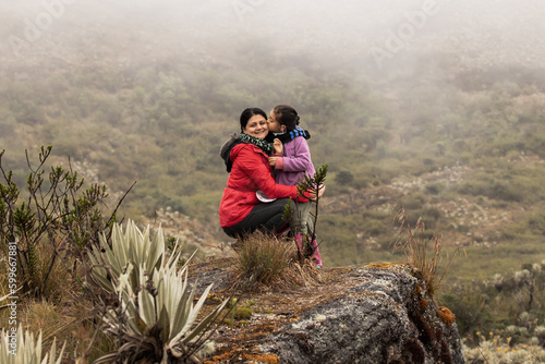 daughter and mother in the forest mountains