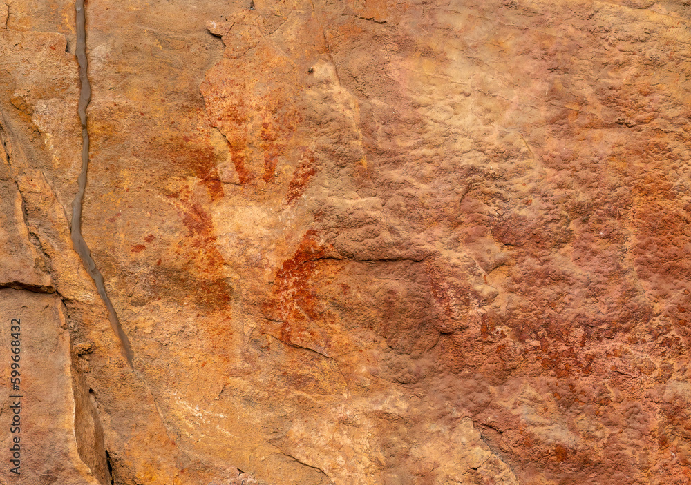 Handprint in Ancient rock art at Burrungui or Burrungkuy (Nourlangie), Arnhem Land Escarpment, Kakadu National Park, Northern Territory, Australia