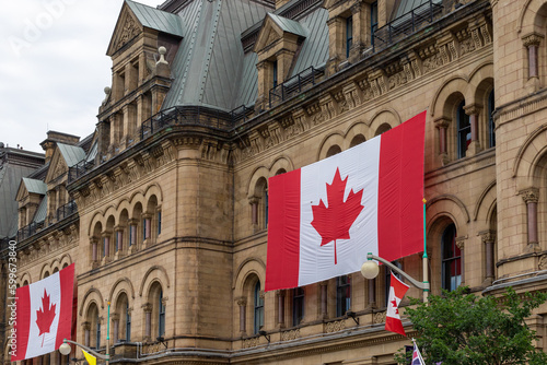 Canada Day. Canadian flags on building. Office of the Prime Minister and Privy Council in Ottawa.