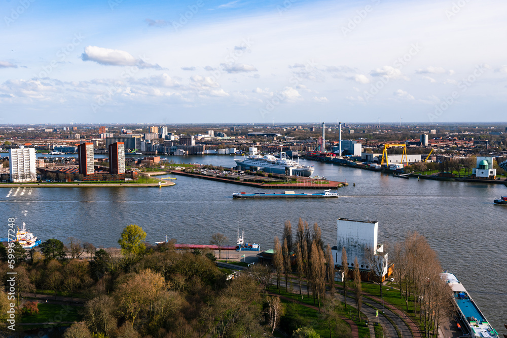 Naklejka premium Rotterdam Netherlands port and cityscape. Panoramic view from Euromast tower, sunny day, cloudy blue sky 