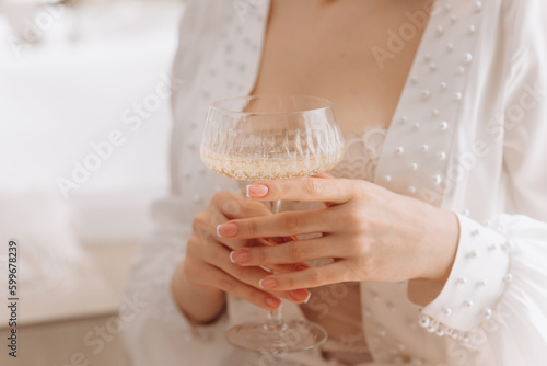 bride holding a glass of champagne