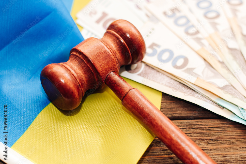 Gavel judges on the table with Ukrainian hryvnias in the denomination of 500 hryvnias. Gavel judges on the table with Ukrainian hryvnias in the denomination of 500 hryvnias.