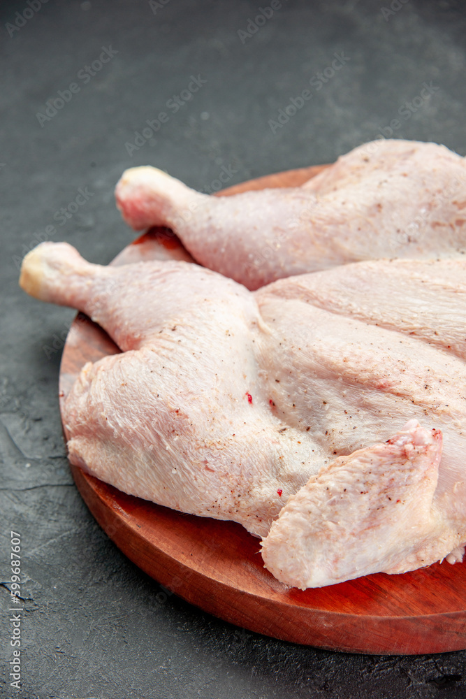 front view fresh raw chicken on dark background cooking dish food salad color dinner bird front view fresh raw chicken on dark background cooking dish food salad color dinner bird